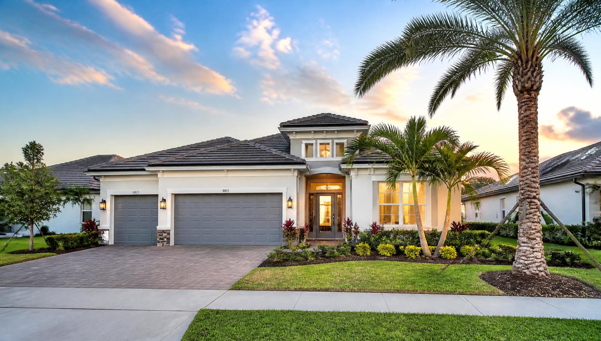 Modern Central Florida home with palm trees at golden hour